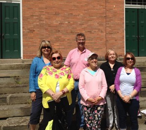 On steps of First Church